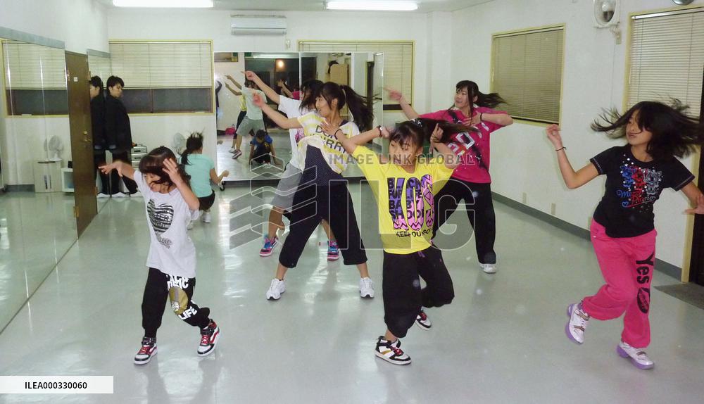 Children taking dance lesson