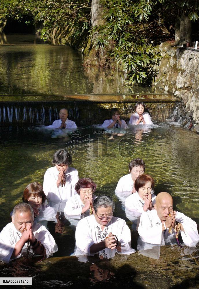 People purify themselves by bathing in cold water at Koyasan