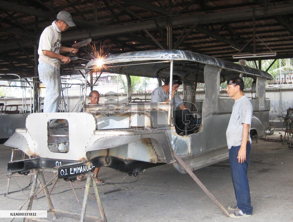 Men assemble jeepney in Philippines