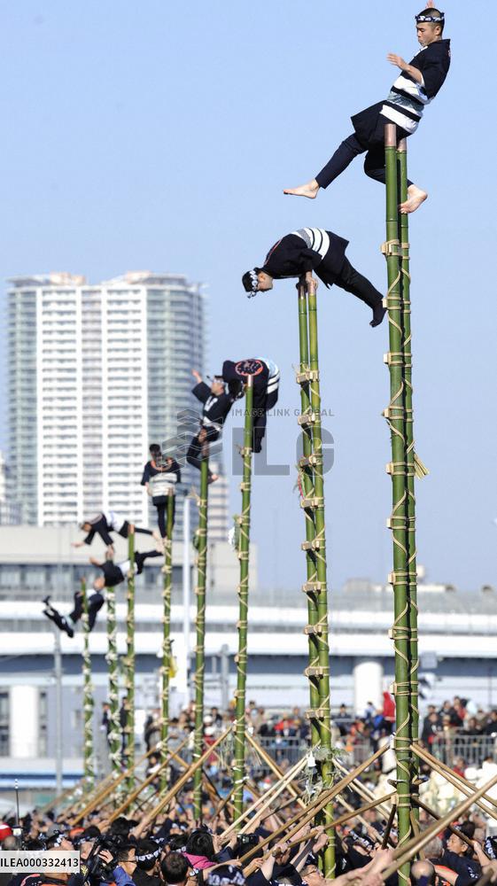 Fire brigades demonstrate traditional ladder-top stunts