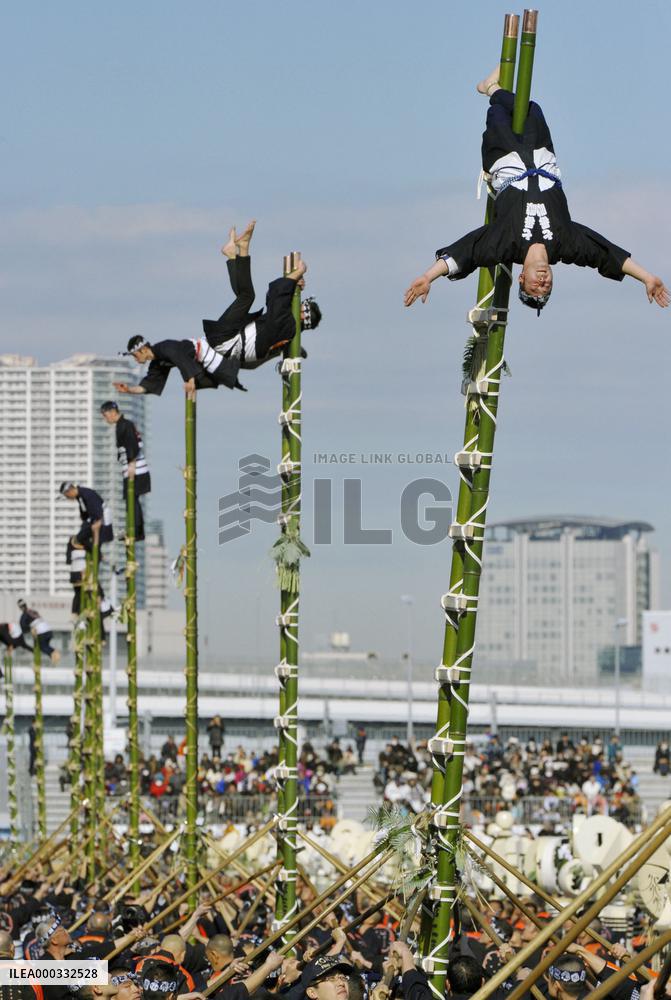 New Year ladder-top stunts by firefighters