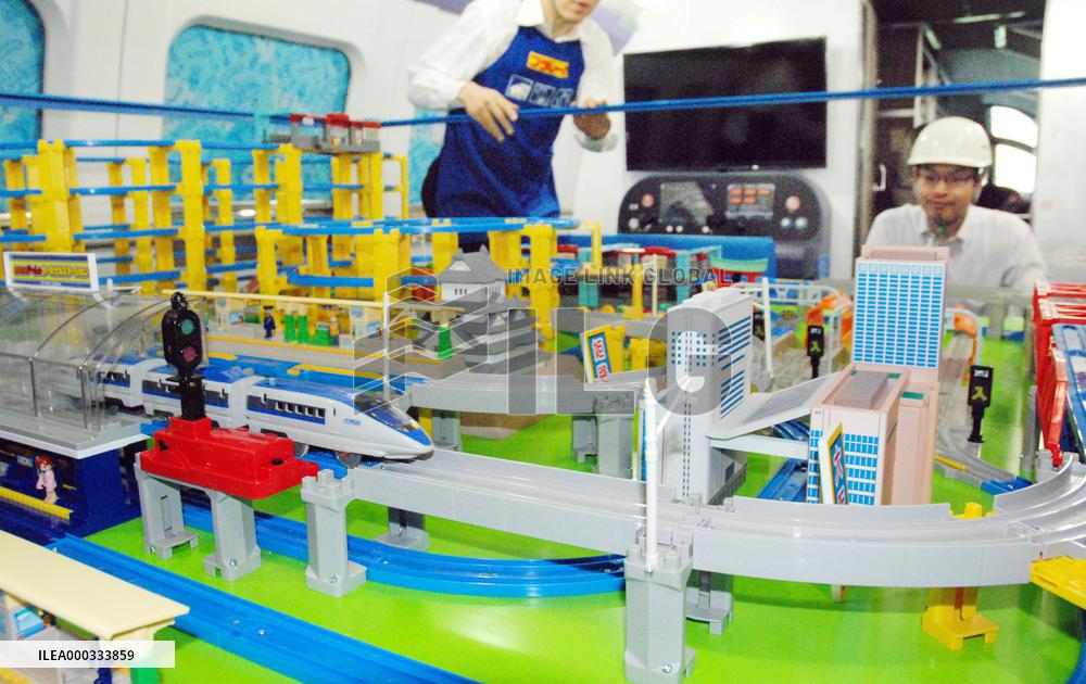 Model train diorama installed on Shinkansen train