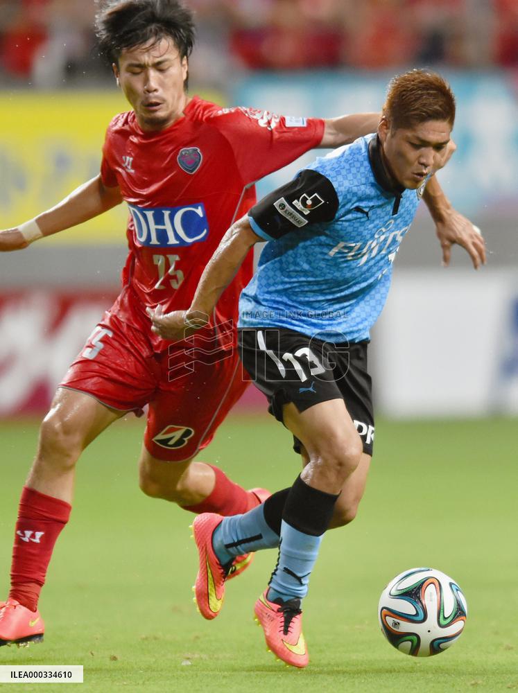 Kawasaki, Tosu J-League players compete for ball
