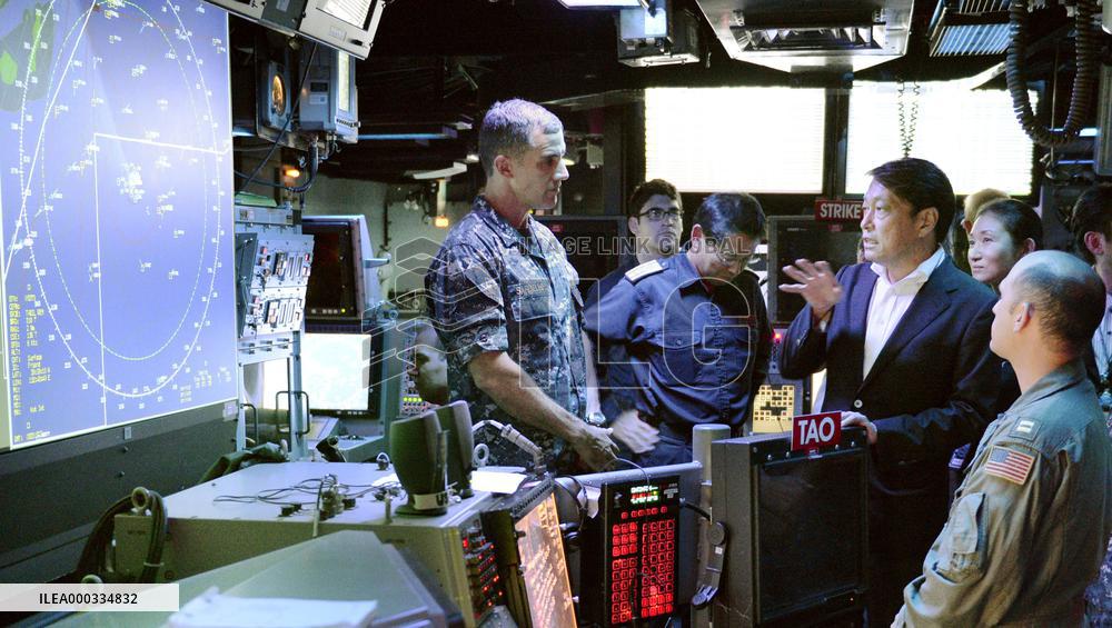 Japan defense minister inspects U.S. aircraft carrier