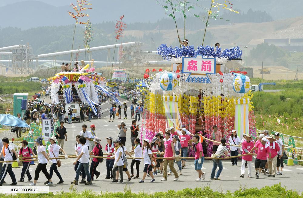 People draw floats at festival in tsunami-hit north Japan