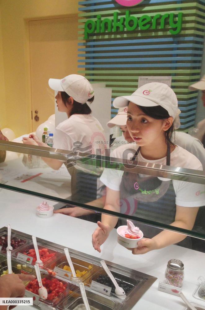 Worker takes order at Pinkberry's 1st outlet in Japan
