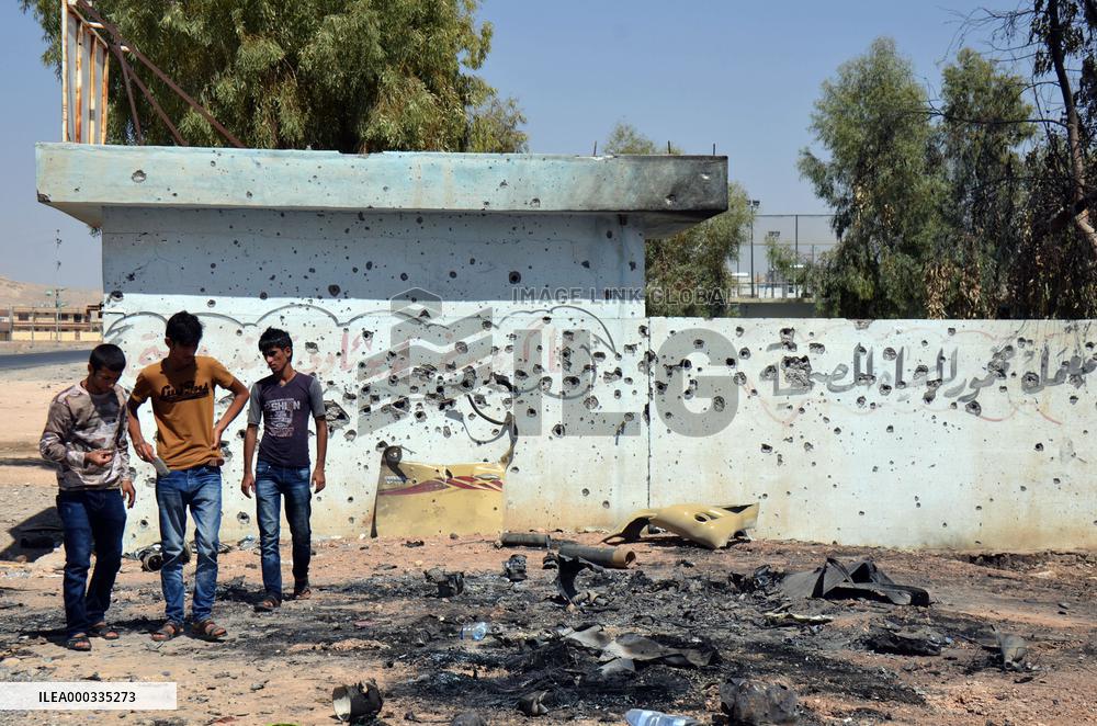 Debris-littered street hit by U.S. airstrikes in Iraq