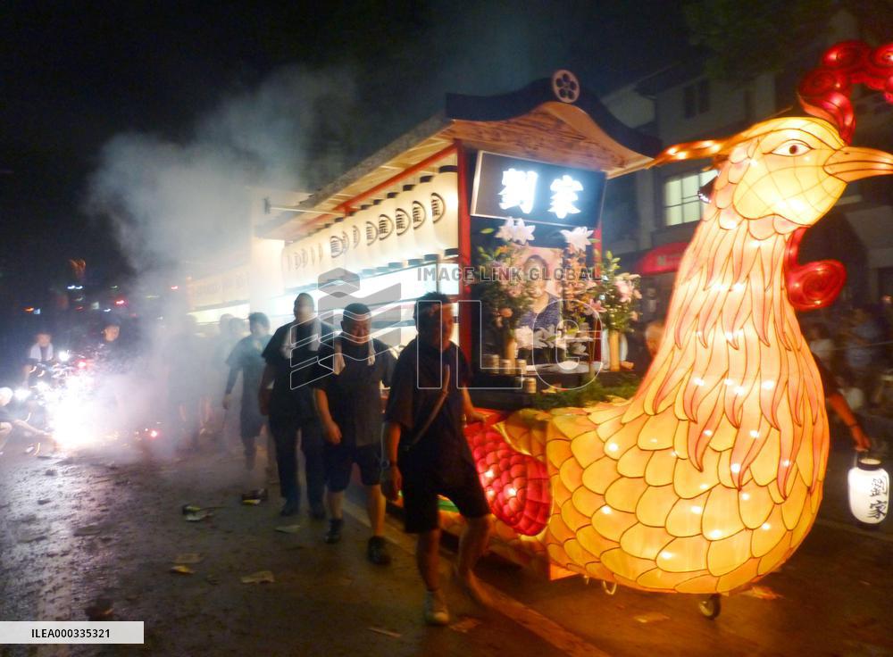 Phoenix boat pulled in Nagasaki Buddhist festival