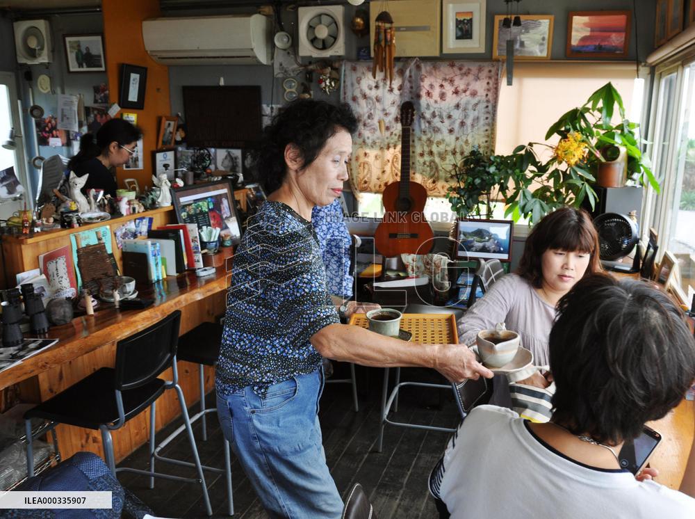 Owner of cafe set in prize-winning movie at work