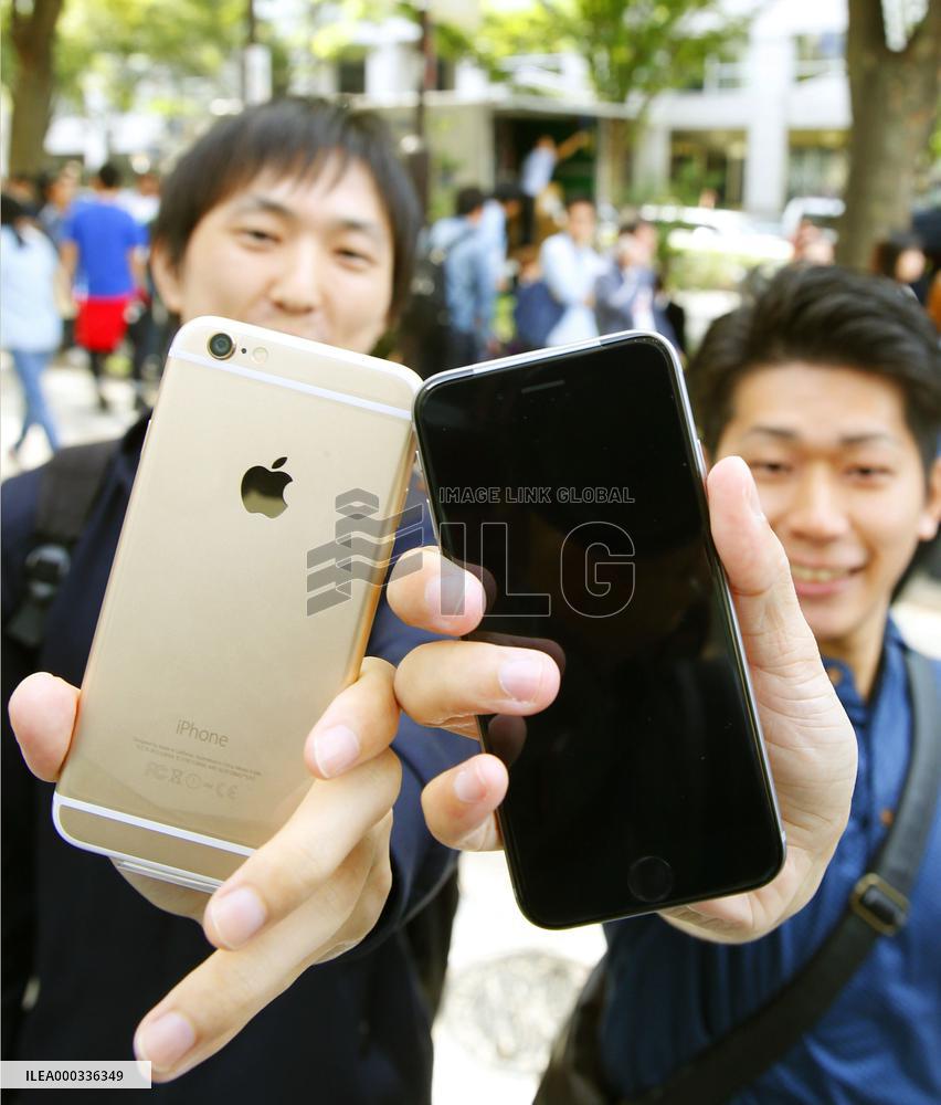 Apple's new iPhone models go on sale in Japan