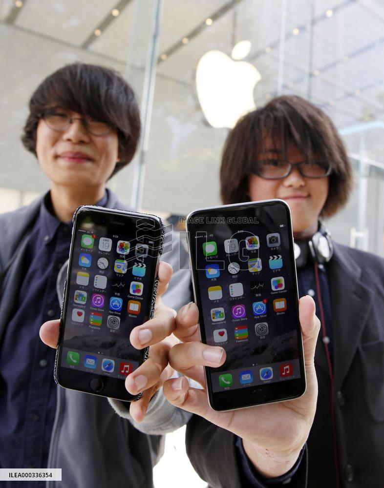 Apple's new iPhone models go on sale in Japan