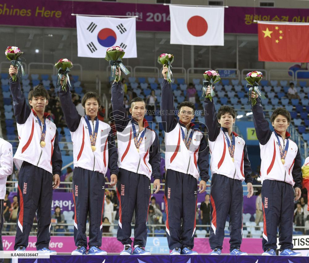 Japan stuns China to win men's gymnastics team gold