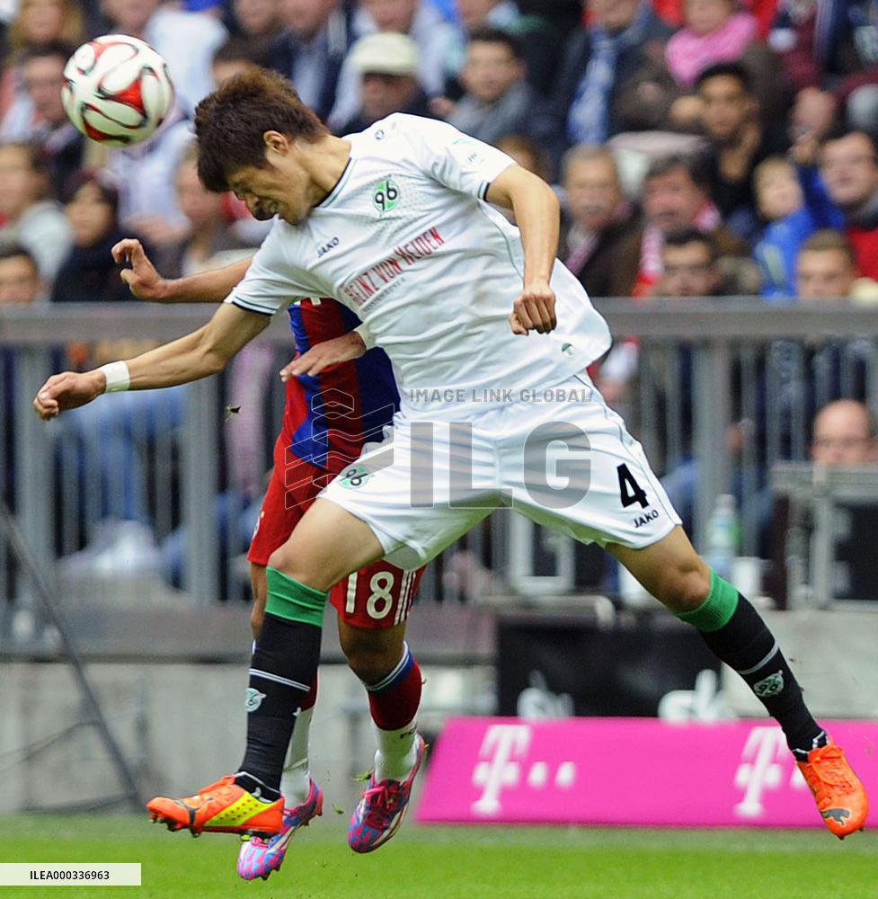 Hanover's Japan defender Sakai in action against Munich