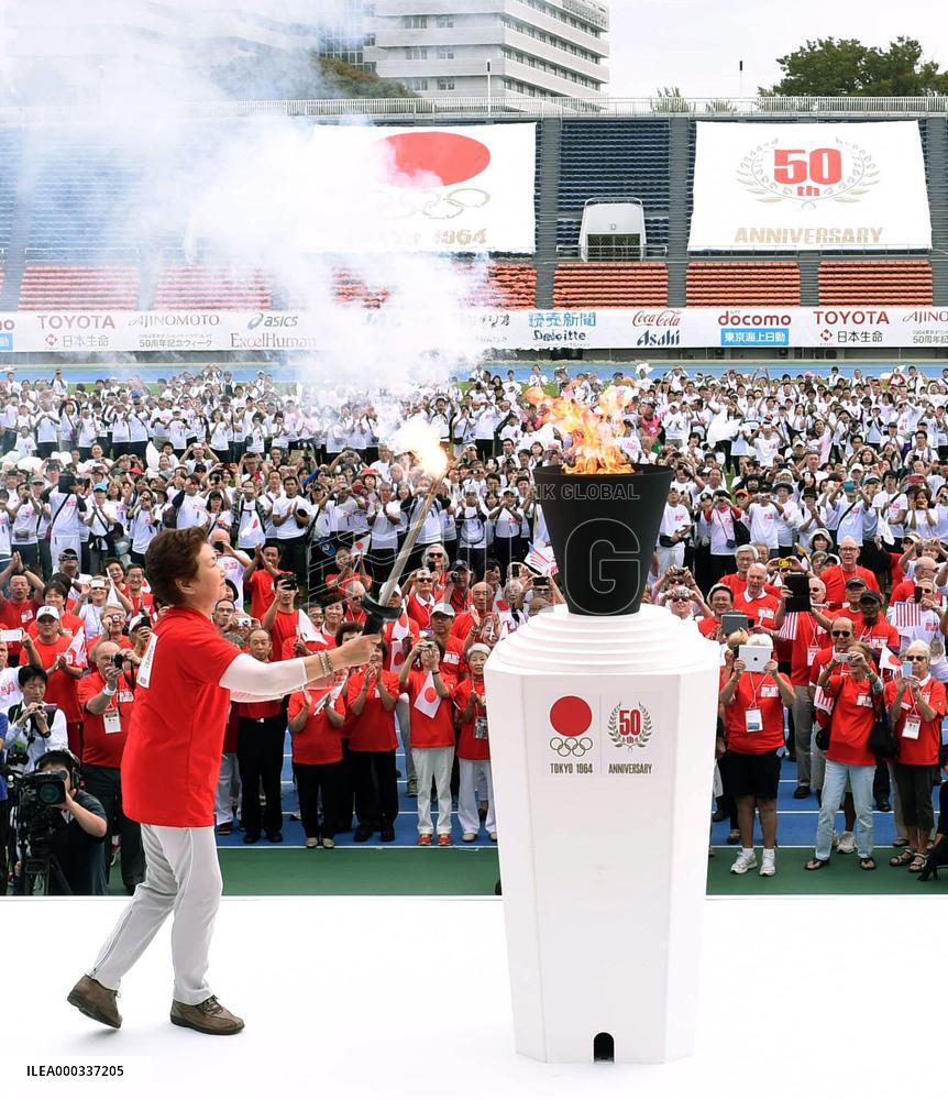 1964 Olympic medalist lights cauldron at anniversary event
