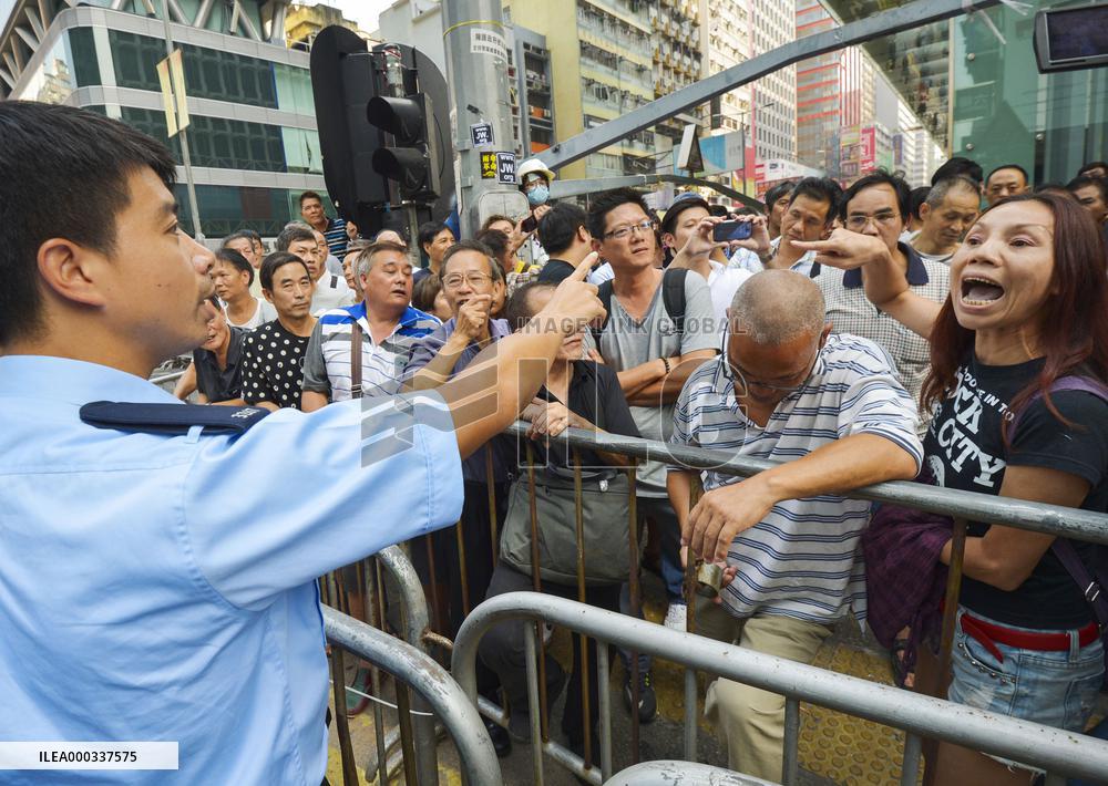 People opposed to pro-democracy protests in H.K.