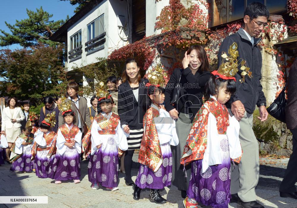 Infants in ancient costumes parade at west Japan temple