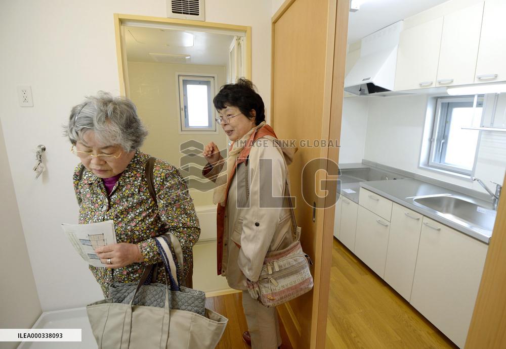 Residents check apartment built for nuke disaster evacuees