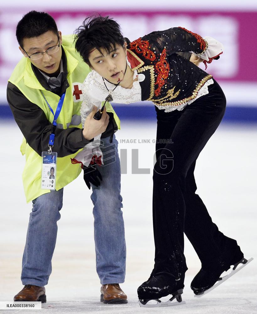 Hanyu manages silver after warm-up collision