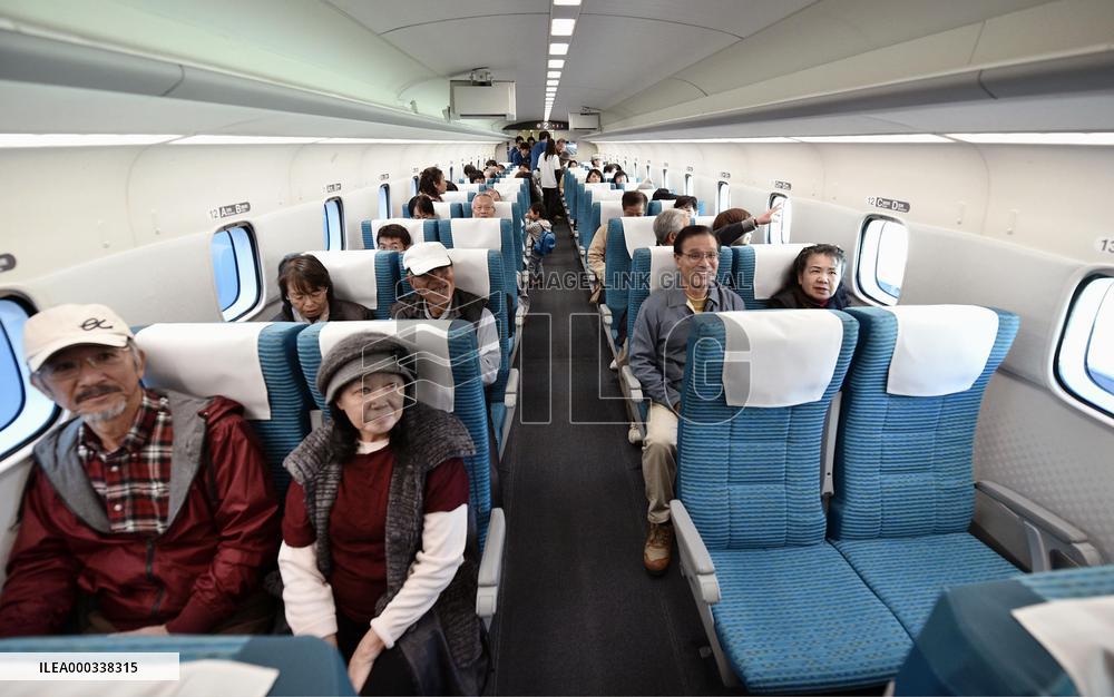 People take demonstration ride on Maglev train