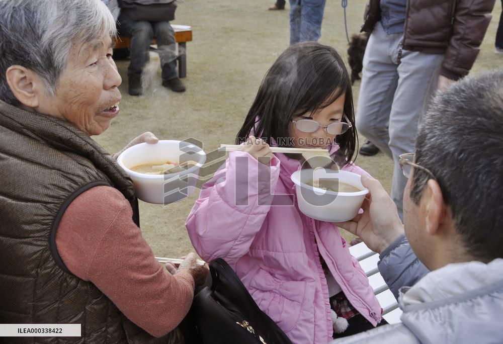 People enjoy cooked anglerfish at festival