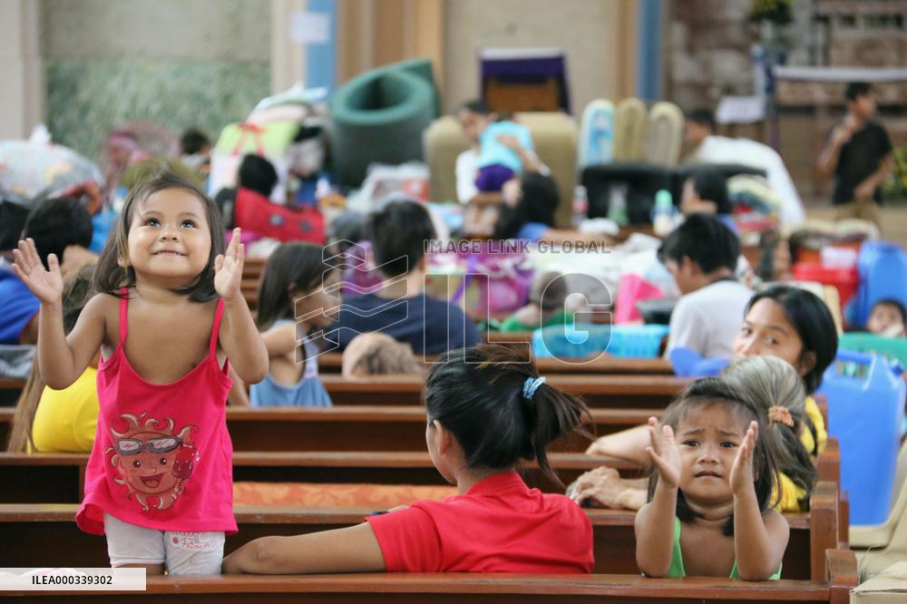 Philippine children take shelter at church