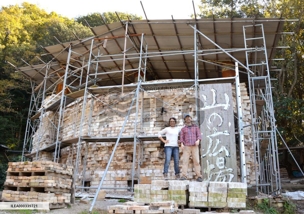 Foreign couple building theater on Japan mountain