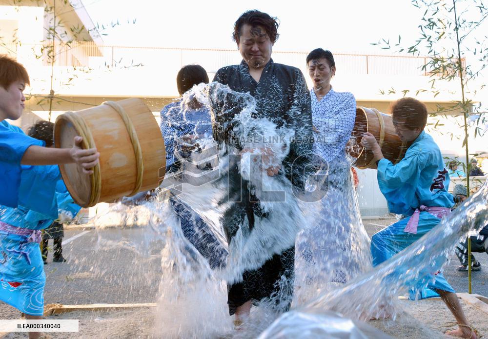 Newly-wed husbands doused with cold water in Fukushima ritual