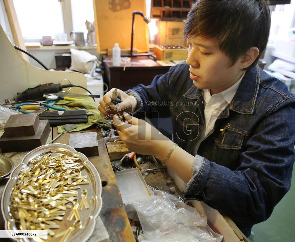 H.K. artist makes copper ribbons as pro-democracy symbol