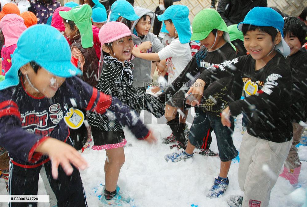 Okinawa children play in snow