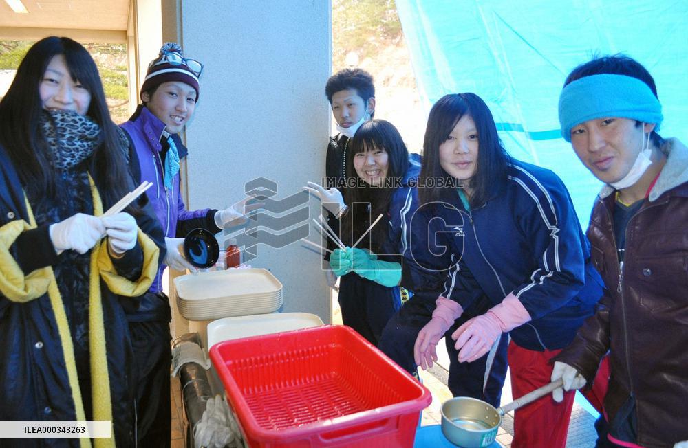 Students help run evacuation center