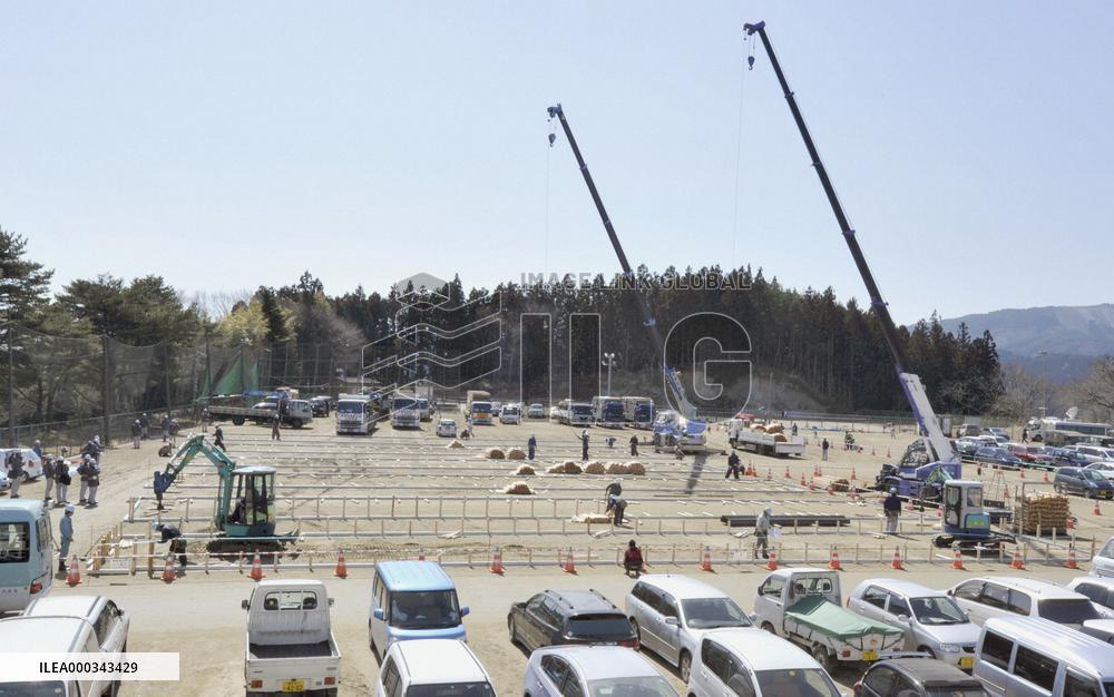 Construction of temporary housing starts in quake-hit city