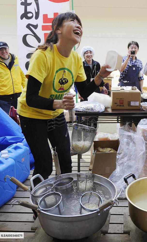 Gold medalist Takahashi at evacuation center