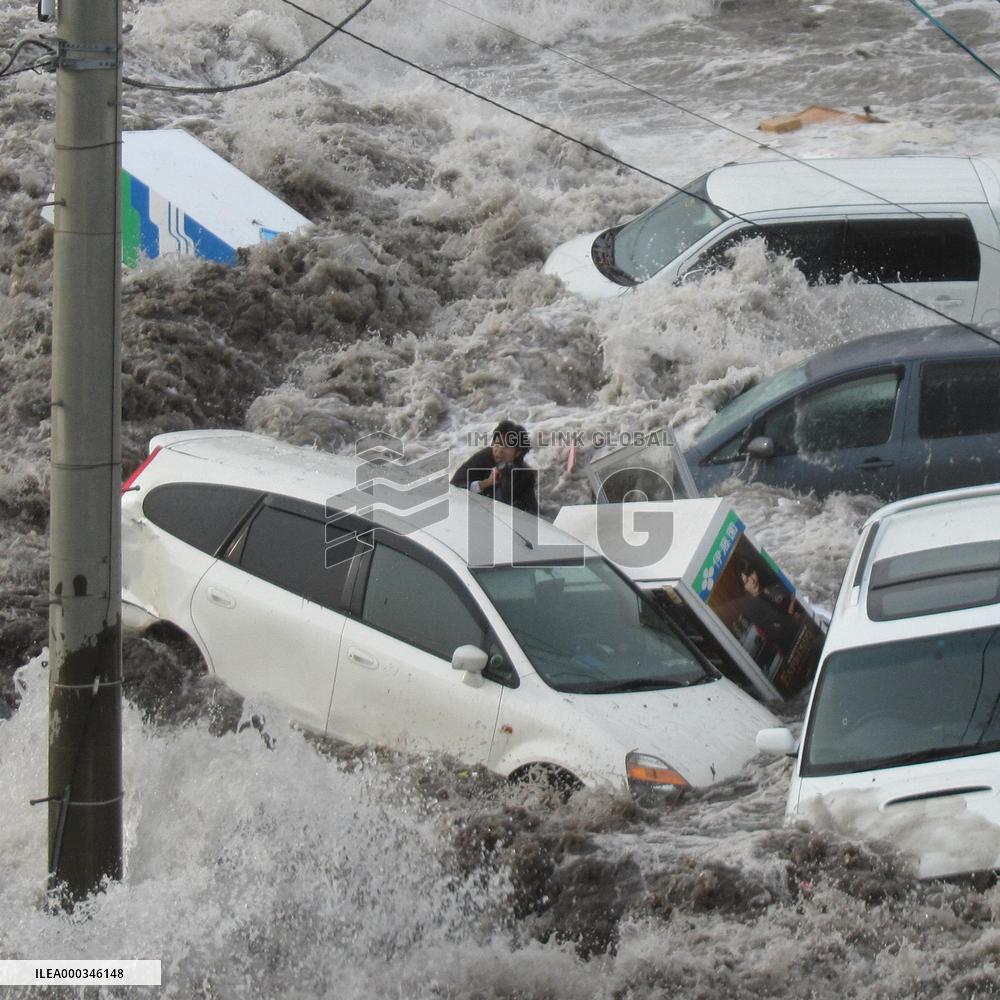 CORRETED Local reporter survives killer tsunami