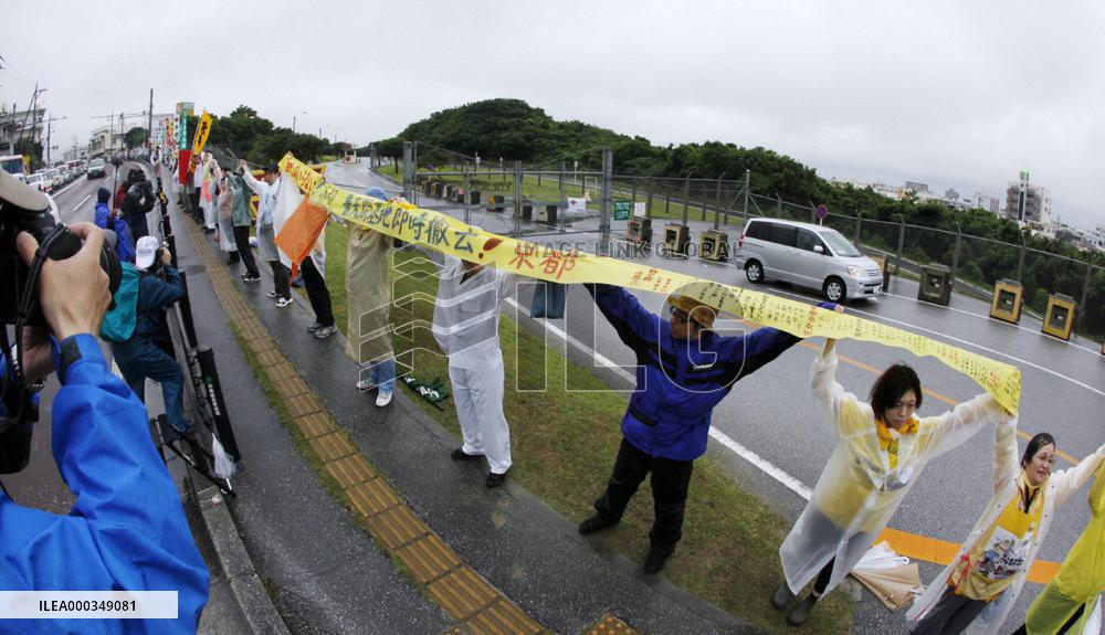 17,000 people encircle Futemma base in 'human chain'