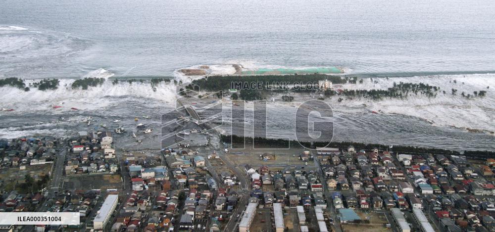 Yuriage coastal area being hit by tsunami