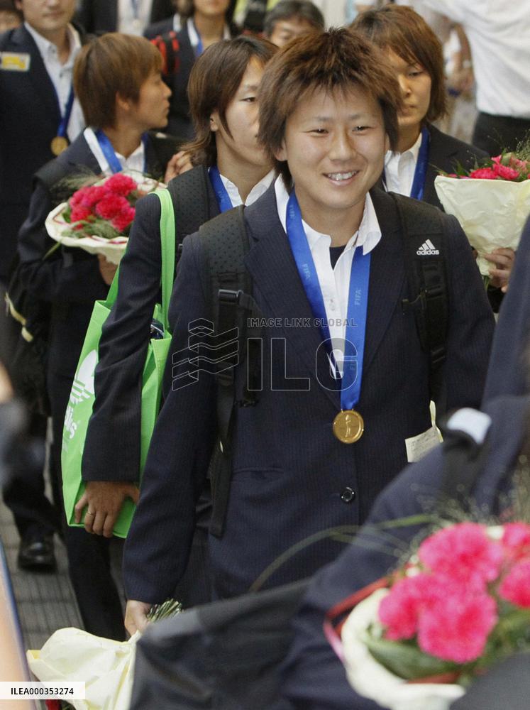'Nadeshiko Japan' return home after victory
