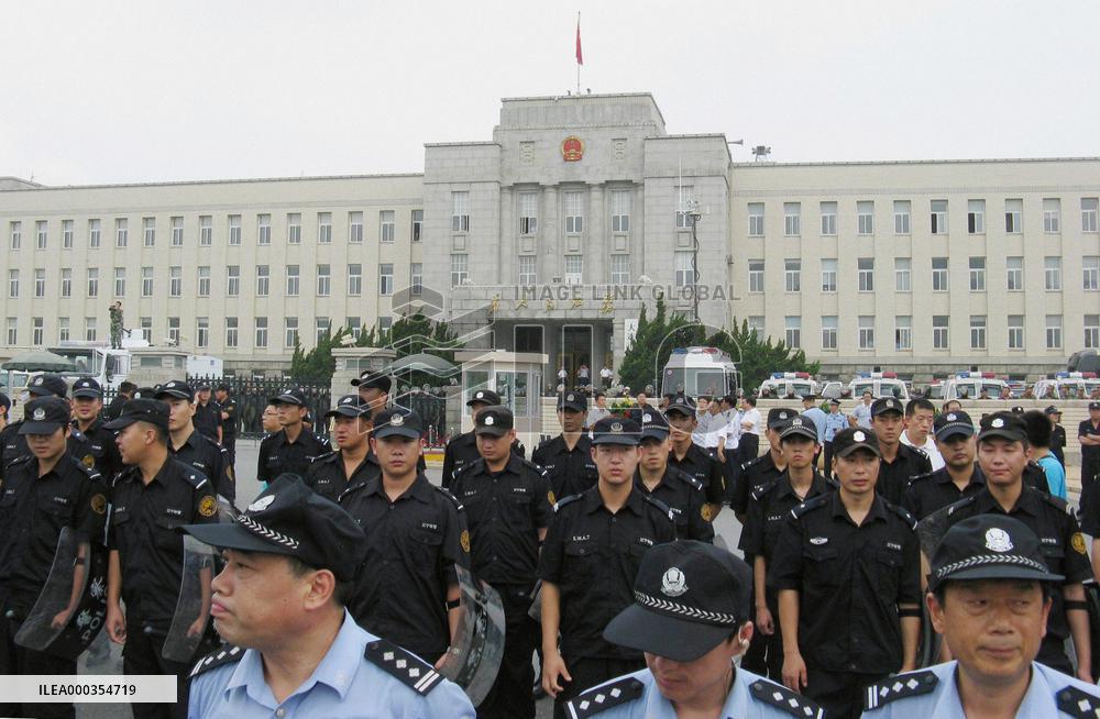 Police stand guard city building in Dalian