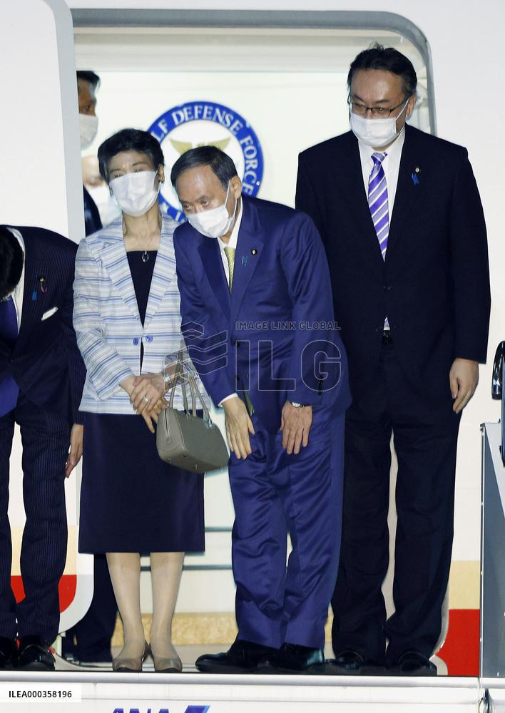 Japan PM Suga departs for G-7 summit in Britain