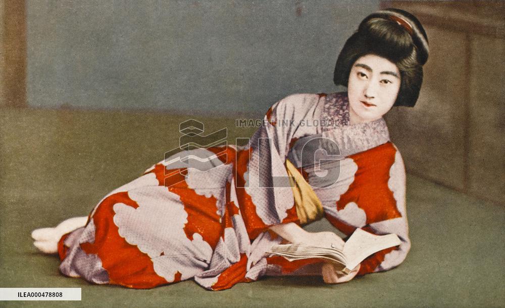Reclining Japanese girl reading