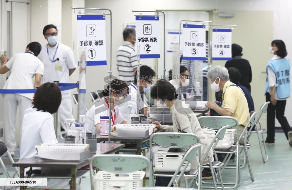 Japan starts vaccinating people aged 18 or older at state-run centers