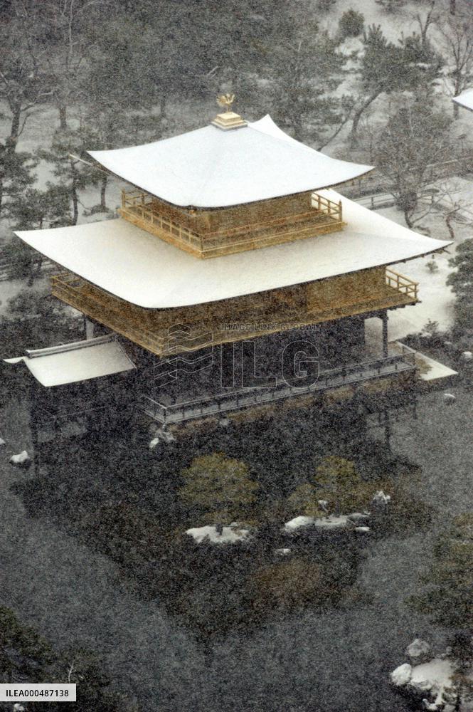 Snow falls on Kyoto's Golden Pavilion