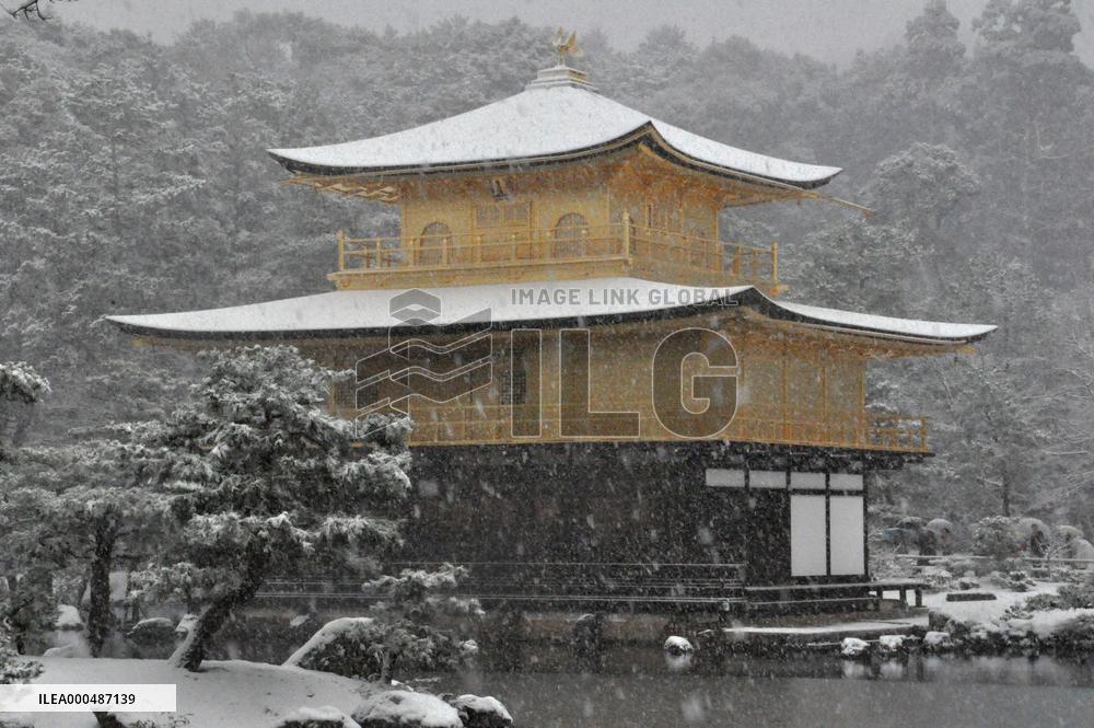 Snow falls on Kyoto's Golden Pavilion