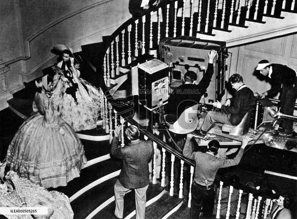 DIRECTOR VICTOR FLEMING (ON STAIRS BACK TO CAMERA) DIRECTING
