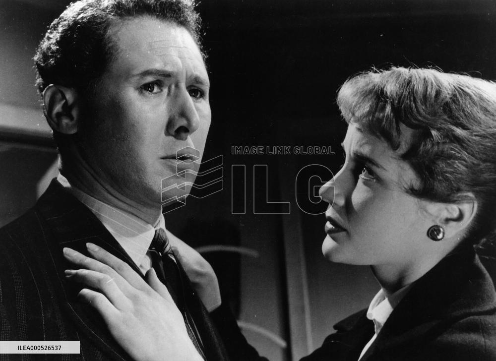 WOMAN IN A DRESSING GOWN