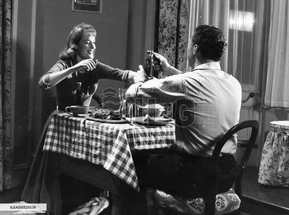 WOMAN IN A DRESSING GOWN