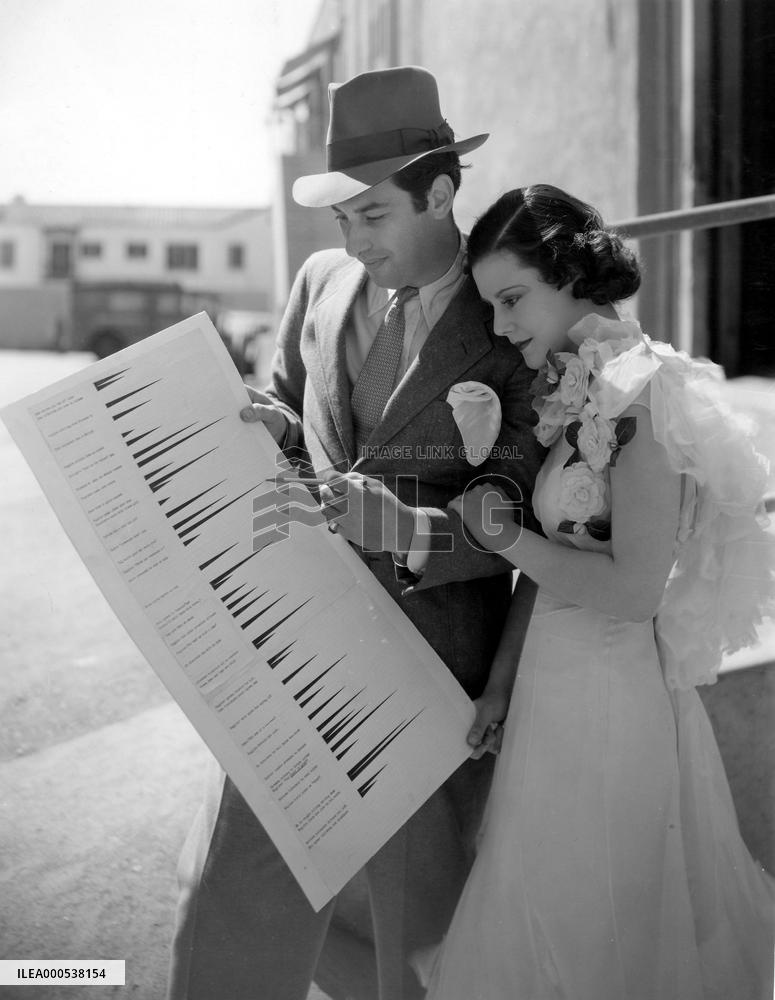 Director MARK SANDRICH explains the 'Laughograph' to HELEN M