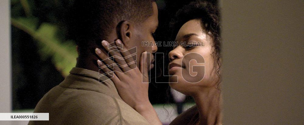 JAMIE FOXX as Detective Ricardo Tubbs and NAOMIE HARRIS as h