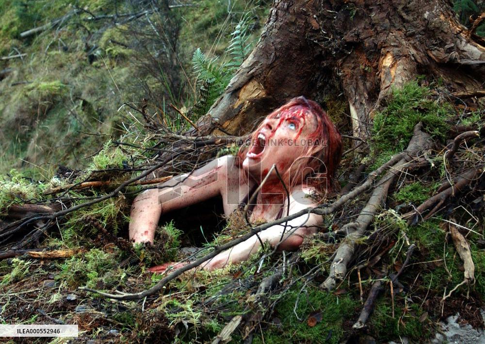 THE DESCENT  Sarah (Shauna Macdonald) bursting out of the gr