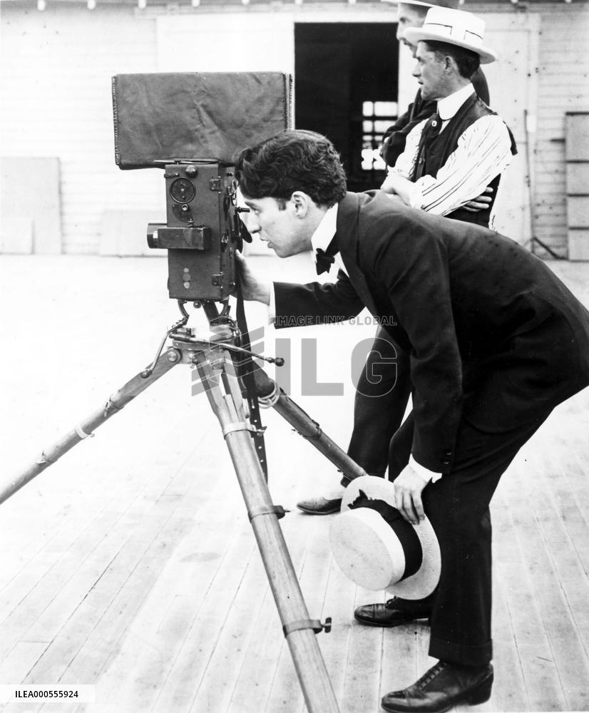 CHARLIE CHAPLIN on set of unidentified film
