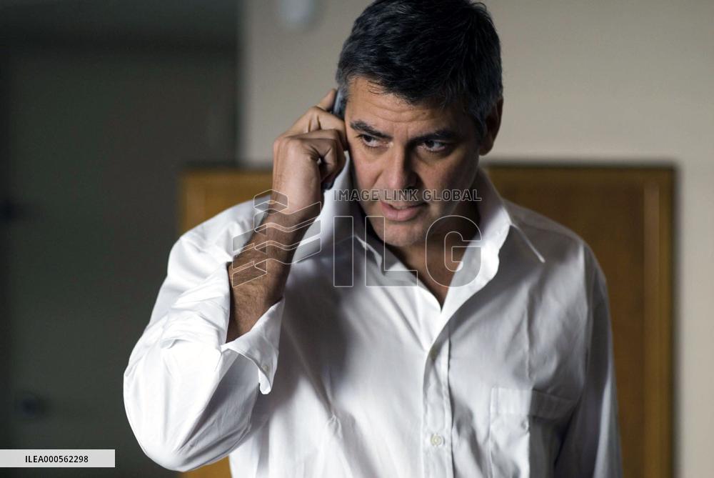 Michael Clayton (GEORGE CLOONEY) in his Milwaukee hotel suit